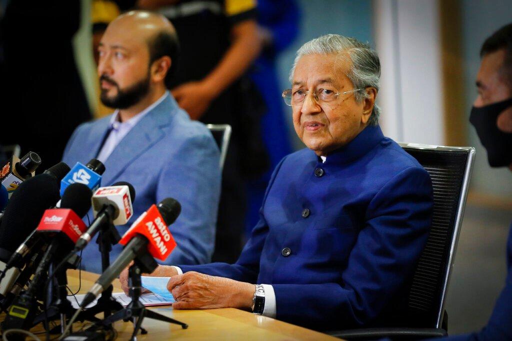 Former prime minister Dr Mahathir Mohamad with his son Mukhriz Mahathir at a press conference to announce the formation of the Pejuang bloc on Aug 7, 2020. Photo: AP