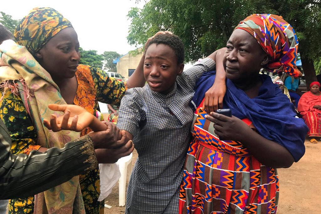 A student who was abducted and then released is reunited with her family at the Bethel Baptist High School in Damishi, Nigeria, on July 25. Photo: AP