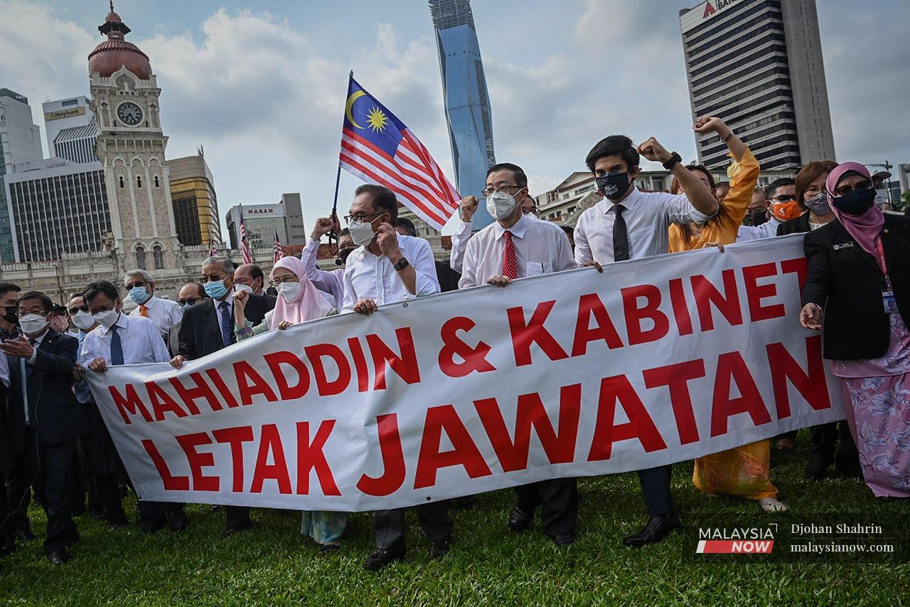 Opposition MPs call for Muhyiddin Yassin's resignation as prime minister during a protest at Dataran Merdeka on Aug 1.