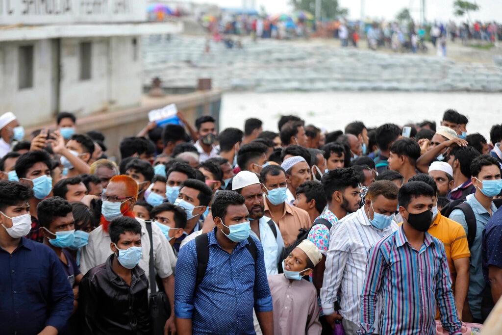 People crowd a ferry terminal to leave the city ahead of the lockdown which began on July 1, at the Shimulia ferry terminal in Munshiganj, on the outskirts of Dhaka, Bangladesh, June 30. Photo: AP