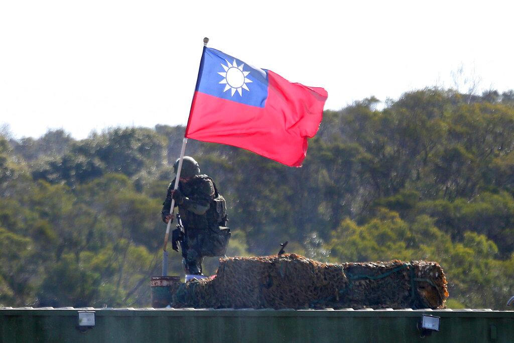 A soldier holds a Taiwanese flag during a military exercise aimed at repelling an attack from China in Hsinchu county, northern Taiwan, in this Jan 19 file photo. Photo: AP