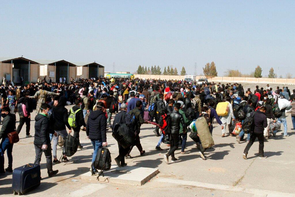 In this March 18, 2020 file photo, thousands of Afghan refugees enter Afghanistan at the Islam Qala border crossing with Iran, in the western Herat province. Hundreds of Afghans have crossed into Turkey in recent weeks amid rising violence in Afghanistan as the Taliban advances. Photo: AP