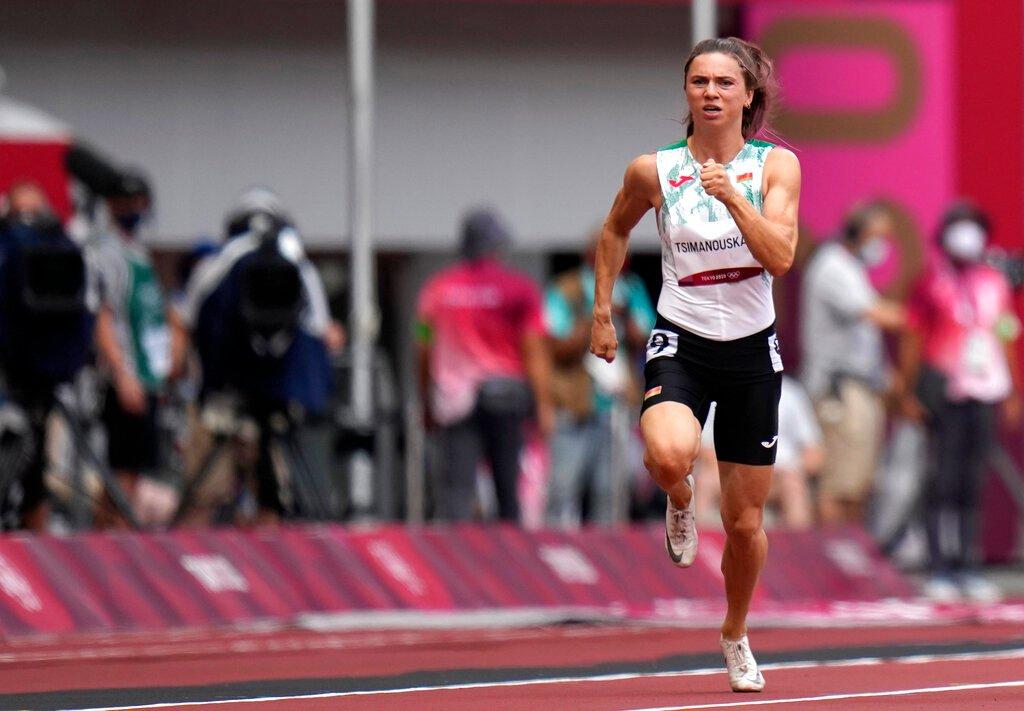 Krystsina Tsimanouskaya, of Belarus, runs in the women's 100m run at the 2020 Summer Olympics, July 30. Photo: AP