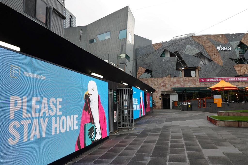 Signage asking people to stay home is seen at Federation Square in downtown Melbourne on Aug 6, amid a sixth lockdown for the city in efforts to bring the Delta outbreak to heel. Photo: AFP