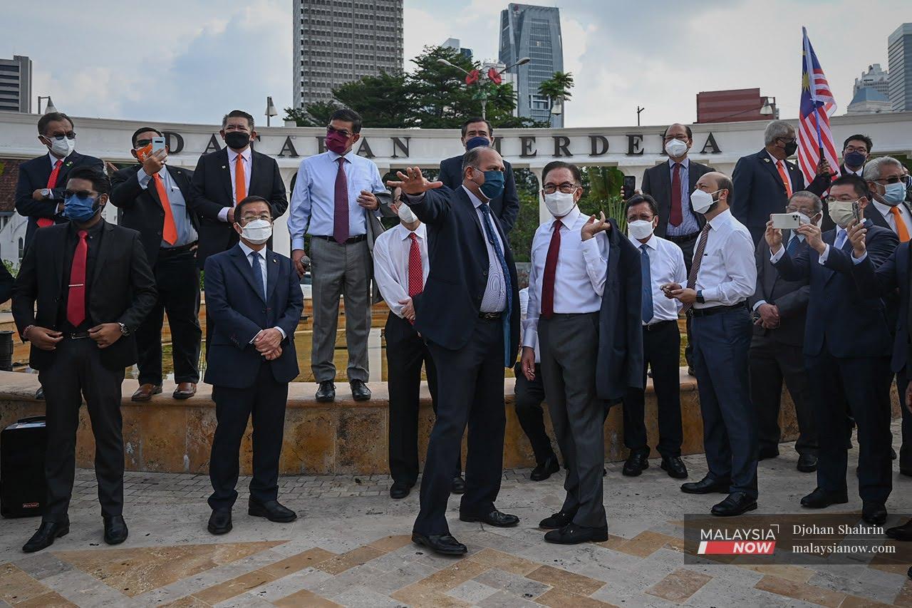 PKR president Anwar Ibrahim with MPs from the opposition at a protest at Dataran Merdeka in Kuala Lumpur on Aug 1, after Parliament was quarantined due to the detection of Covid-19 cases.
