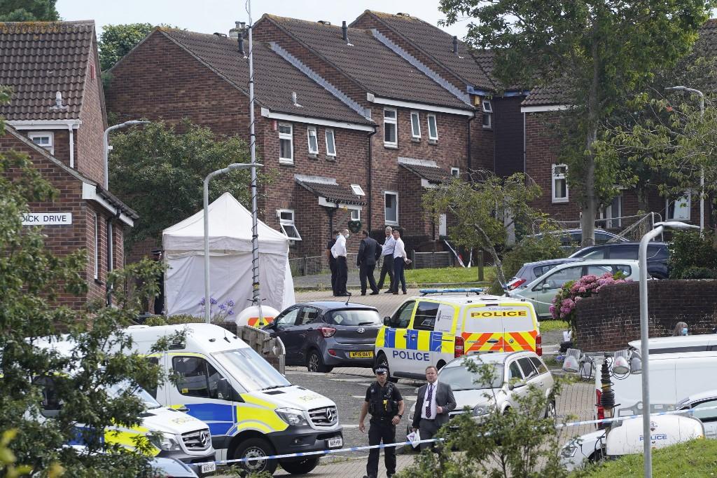 Police officers work at the scene of a shooting incident in Plymouth, southwest England, on Aug 13. British police said they were investigating the background of a troubled loner who obtained a firearms licence and shot dead five people including a three-year-old girl in the country's first mass shooting in 11 years. Photo: AFP