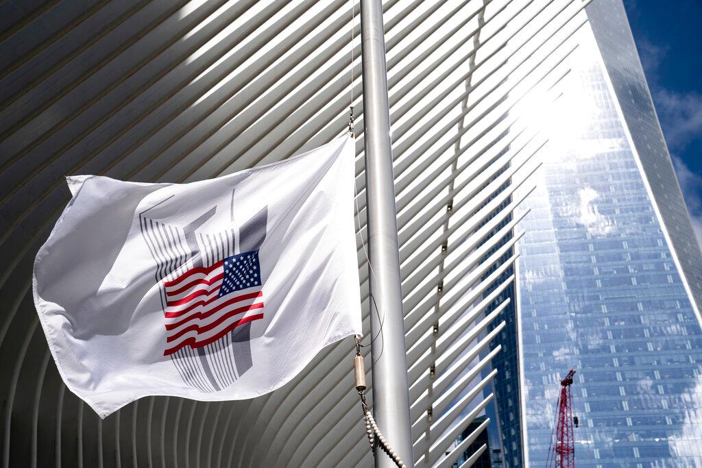 A flag bearing the likeness of the former World Trade Center destroyed in the Sept 11, 2001 terrorist attacks is flown at half-staff during a ceremony in New York, April 30. Photo: AP