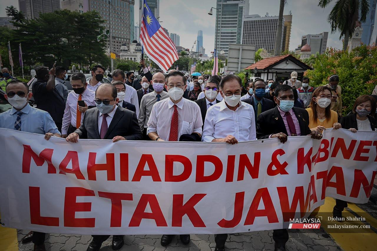 PKR president Anwar Ibrahim together with MPs from the opposition bloc during a protest in Kuala Lumpur on Aug 1 after the Parliament building was placed under quarantine due to the detection of Covid-19 infections.