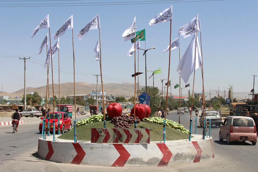 Taliban flags fly at a square in the city of Ghazni, southwest of Kabul, Afghanistan, Aug 14. Photo: AP