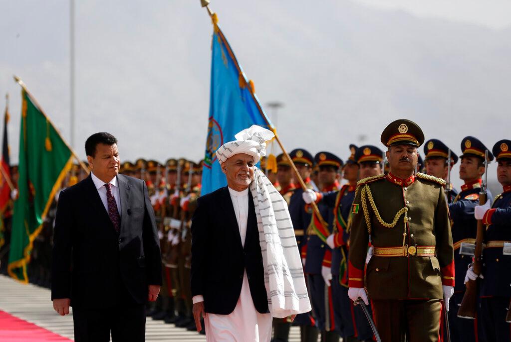 In this March 6 file photo, Afghan President Ashraf Ghani (centre) inspects an honour guard during the opening ceremony of the new legislative session of the Parliament, in Kabul, Afghanistan. Afghanistan’s embattled president left the country Aug 15, joining his fellow citizens and foreigners in a stampede fleeing the advancing Taliban and signalling the end of a 20-year Western experiment aimed at remaking Afghanistan. Photo: AP