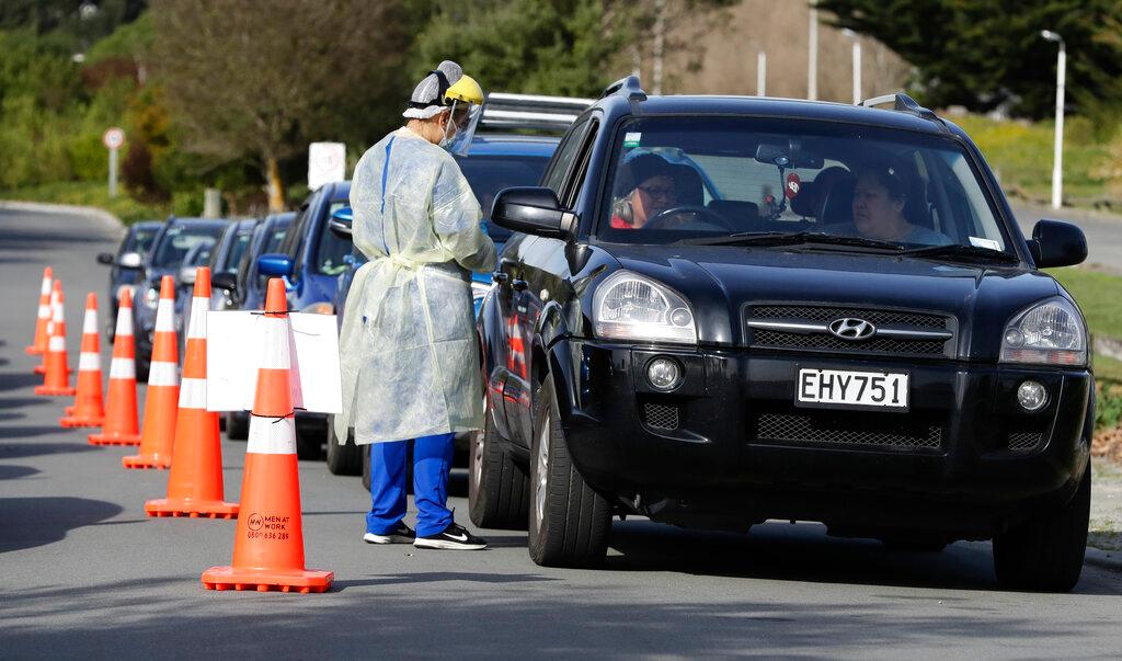 Medical staff prepare take a Covid-19 test from a visitor to a drive-thru community-based assessment centre in Christchurch, New Zealand, in this Aug 13, 2020 file photo. Photo: AP