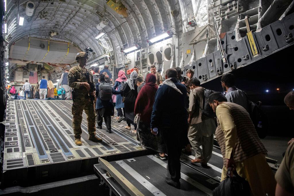 In this Aug 22 photo provided by the US Air Force, Afghan passengers board a US Air Force C-17 Globemaster III during the Afghanistan evacuation at Hamid Karzai International Airport in Kabul, Afghanistan. Photo: AP