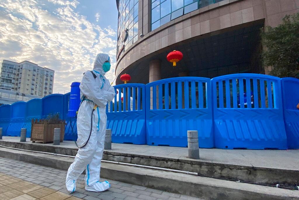 A worker in protective gear walks outside the Wuhan Central Hospital in Wuhan, China, in this Feb 6 file photo. Photo: AP