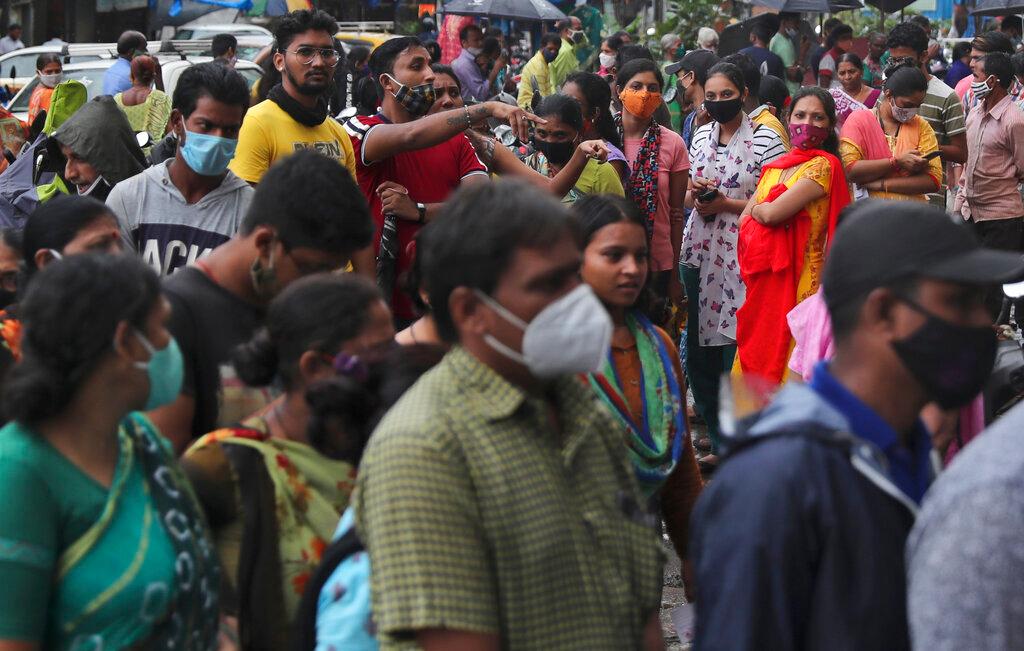 People wait to receive the vaccine for Covid-19 at a vaccination centre in Mumbai, India, Aug 19. Photo: AP