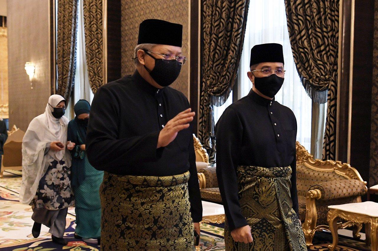 Communications and Multimedia Minister Annuar Musa (left) and International Trade and Industry Minister Mohamed Azmin Ali arrive for the swearing-in ceremony of the new Cabinet at Istana Negara. Photo: Bernama
