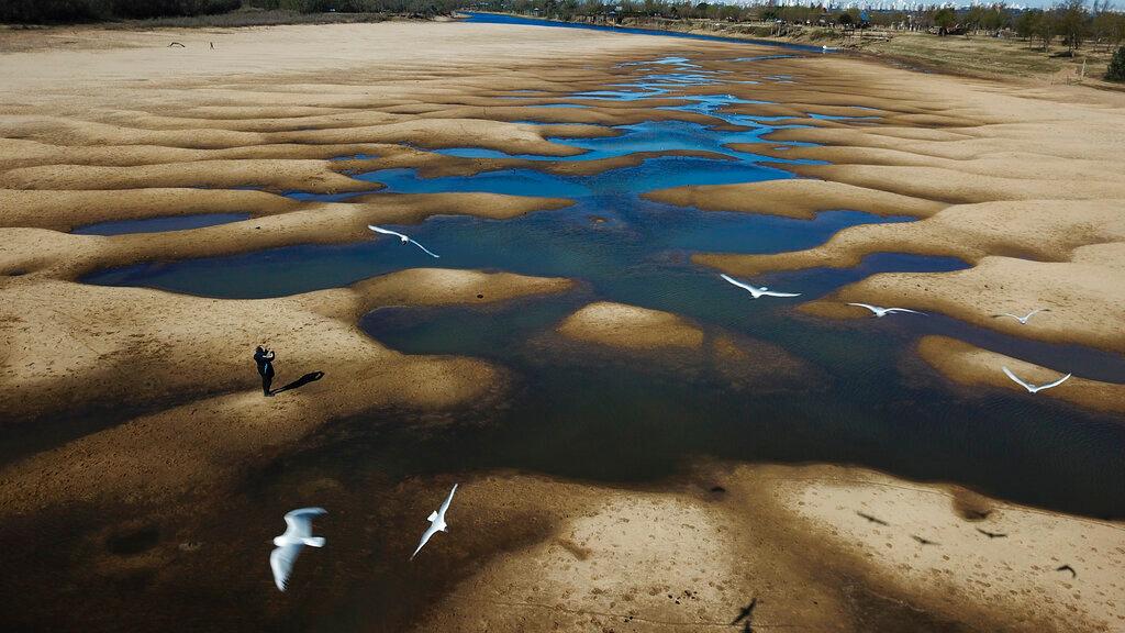 Parana River Basin and its related aquifers provide potable water to close to 40 million people in South America, and according to environmentalists the falling water levels of the river are due to climate change, diminishing rainfall, deforestation and the advance of agriculture. Photo: AP