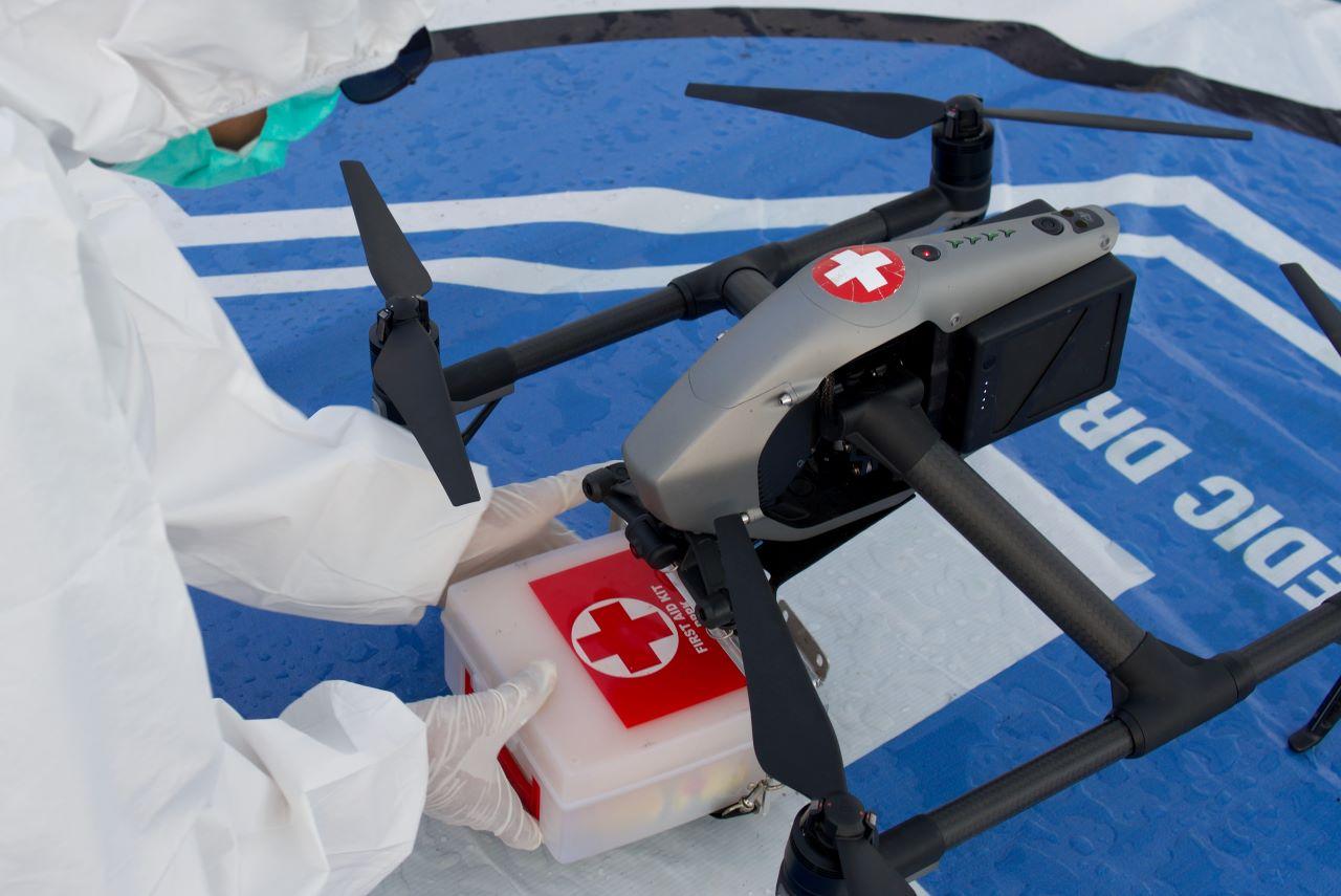 A medical worker wearing personal protective equipment takes a box of medical supplies that is being delivered with a drone on the deck of a passenger ship, which has been modified as an isolation centre for the coronavirus disease patients in Makassar, South Sulawesi province, Indonesia, Aug 27. Photo: Reuters