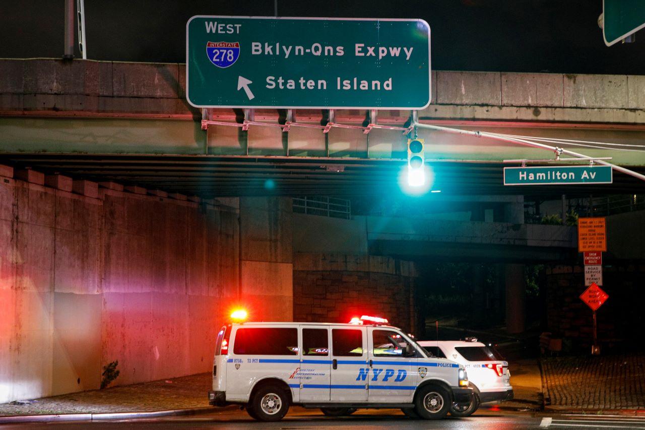 New York City police vehicles block the entrance to the Brooklyn-Queens Expressway due to flooding, as local media report the remnants of tropical storm Ida bringing drenching rain and the threat of flash floods and tornadoes to parts of the northern mid-Atlantic, in the Brooklyn borough of New York City, Sept 2. Photo: Reuters