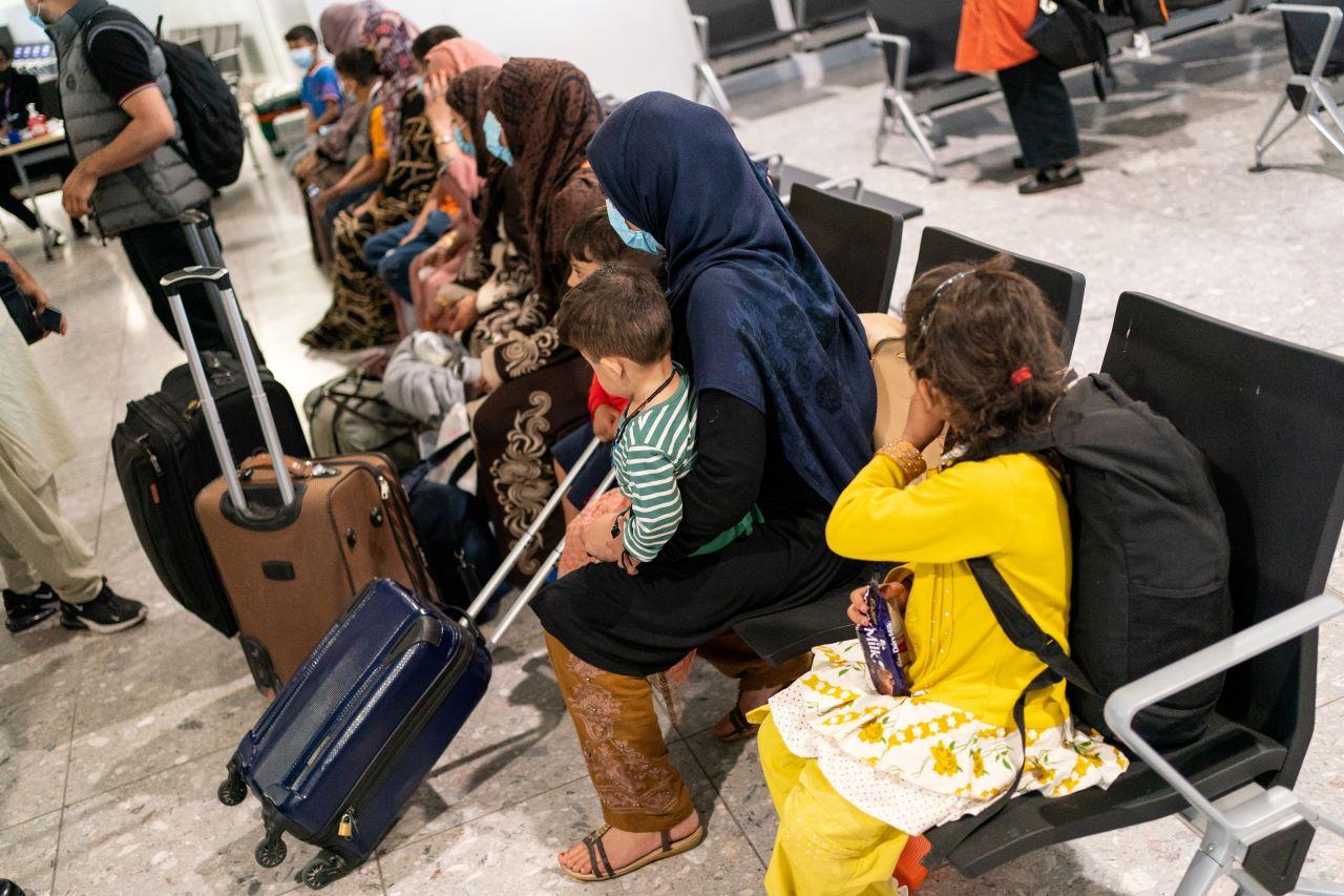 Refugees from Afghanistan wait to be processed after arriving on an evacuation flight at Heathrow Airport, in London, Britain, Aug 26. Photo: Reuters