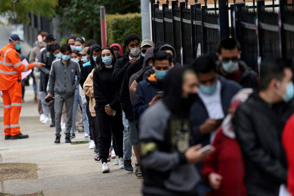 People wait in line outside a coronavirus disease vaccination clinic in the Bankstown suburb during a lockdown to curb an outbreak of cases in Sydney, Australia, Aug 25. Photo: Reuters
