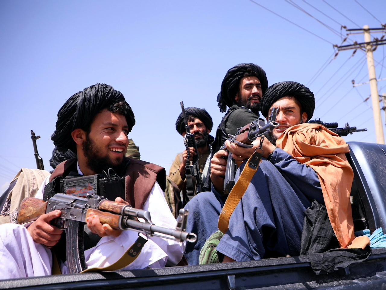 FILE PHOTO: Taliban forces patrol in front of Hamid Karzai International Airport in Kabul