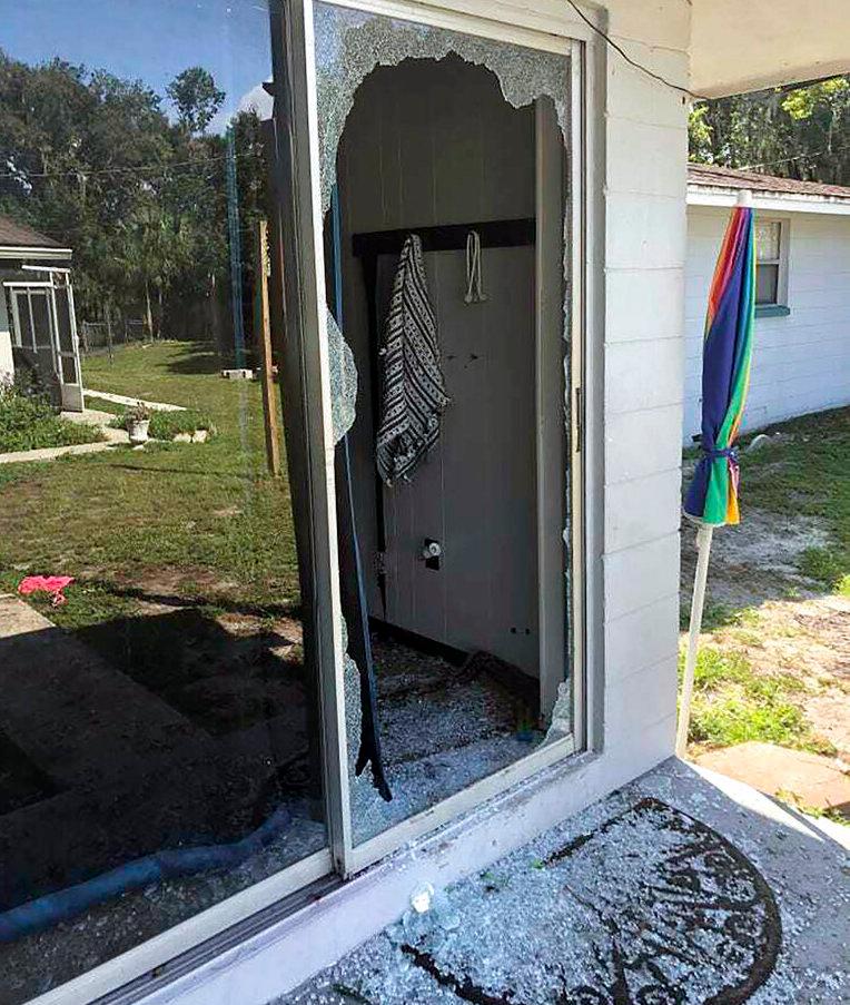 This image provided by the Polk County Sheriff's Office shows the back of the residence where a sheriff's lieutenant entered the house and exchanged fire with a shooting suspect in a neighbourhood in Lakeland, Florida. Photo: AP