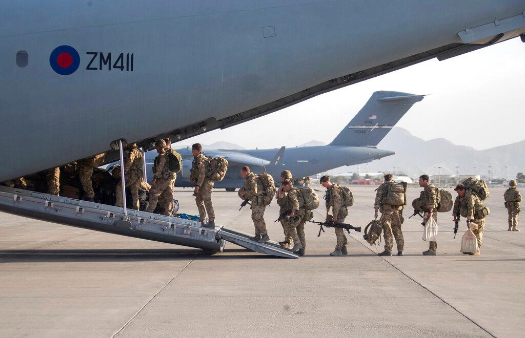 In this handout photo provided by the defence ministry, UK military personnel onboard a A400M aircraft departing Kabul, Afghanistan, Aug 28. Photo: AP