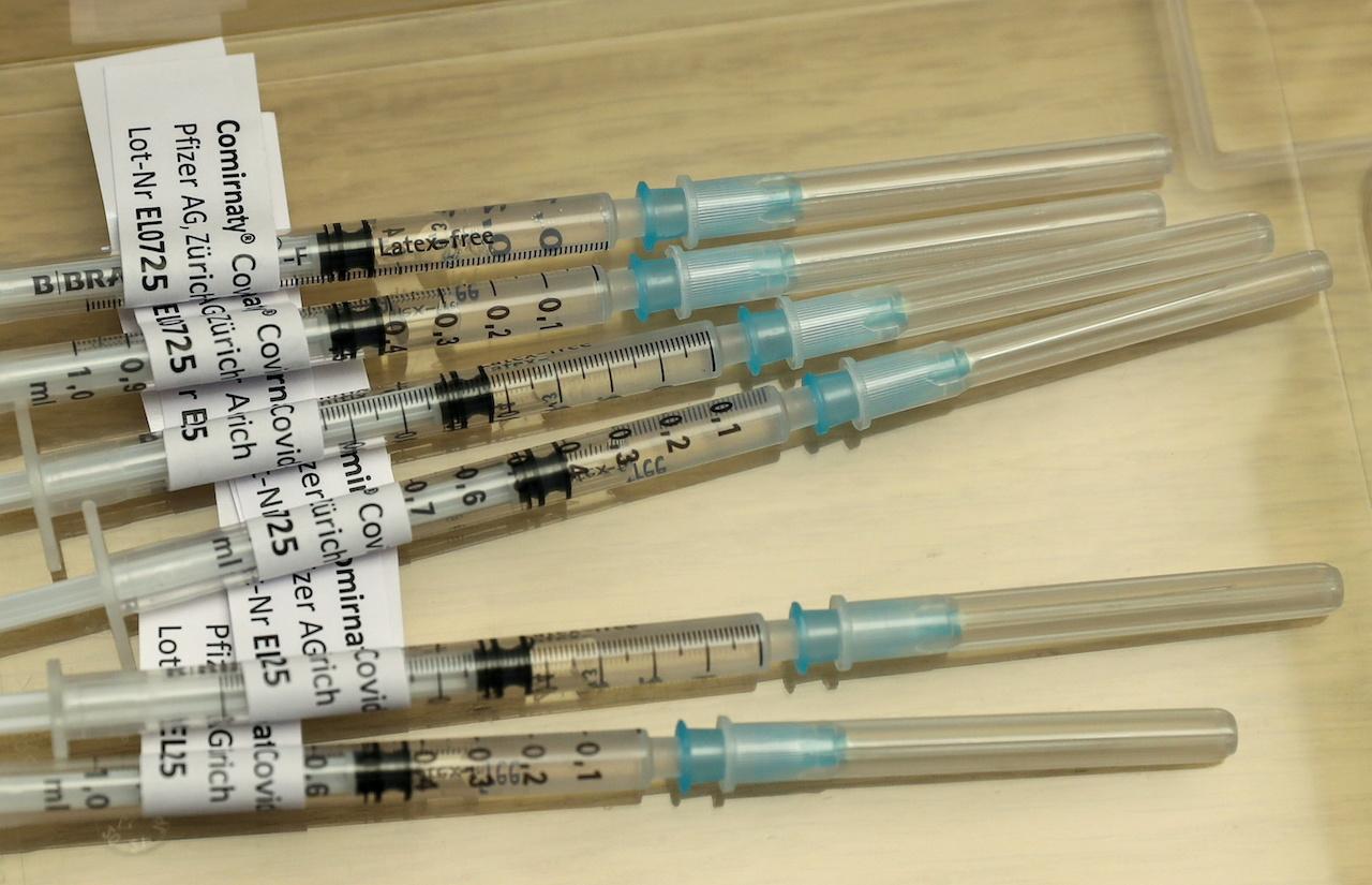 Syringes containing Pfizer-BioNTech Covid-19 vaccine are seen at the Impfzentrum Basel Stadt vaccination centre at the Congress Center of the Messe Basel fairground, in Basel, Switzerland, March 18. Photo: Reuters