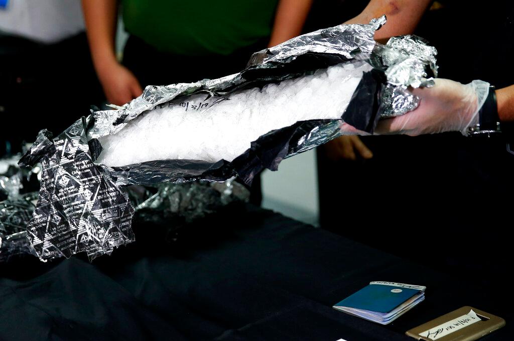 Authorities in the Philippines show a package of methamphetamine seized during a raid in this Oct 7, 2019 file picture. Addiction to meth has been used by the president to justify his war against drugs. Photo: AP