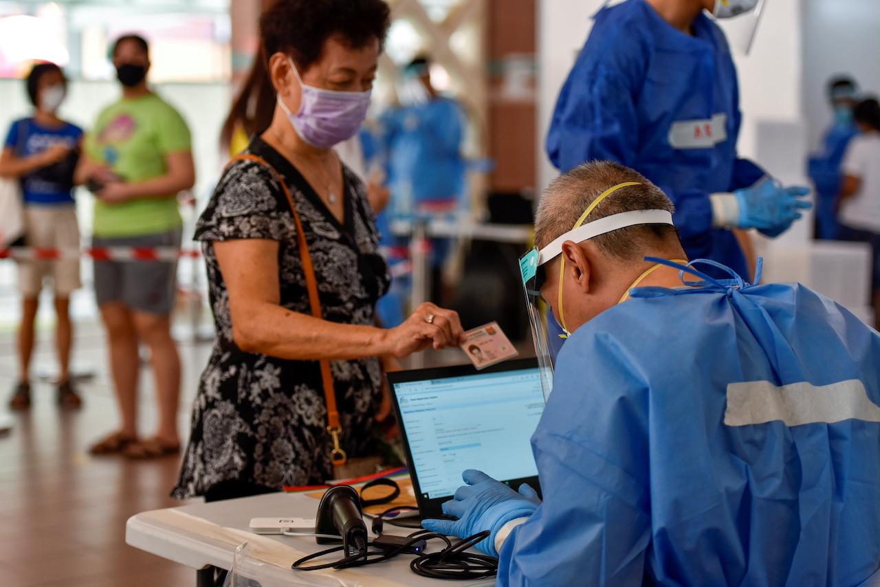 Swab tests are conducted at a public housing estate after a nearby food centre became a Covid-19 cluster, in Singapore, in this June 16 file picture. Photo: Reuters