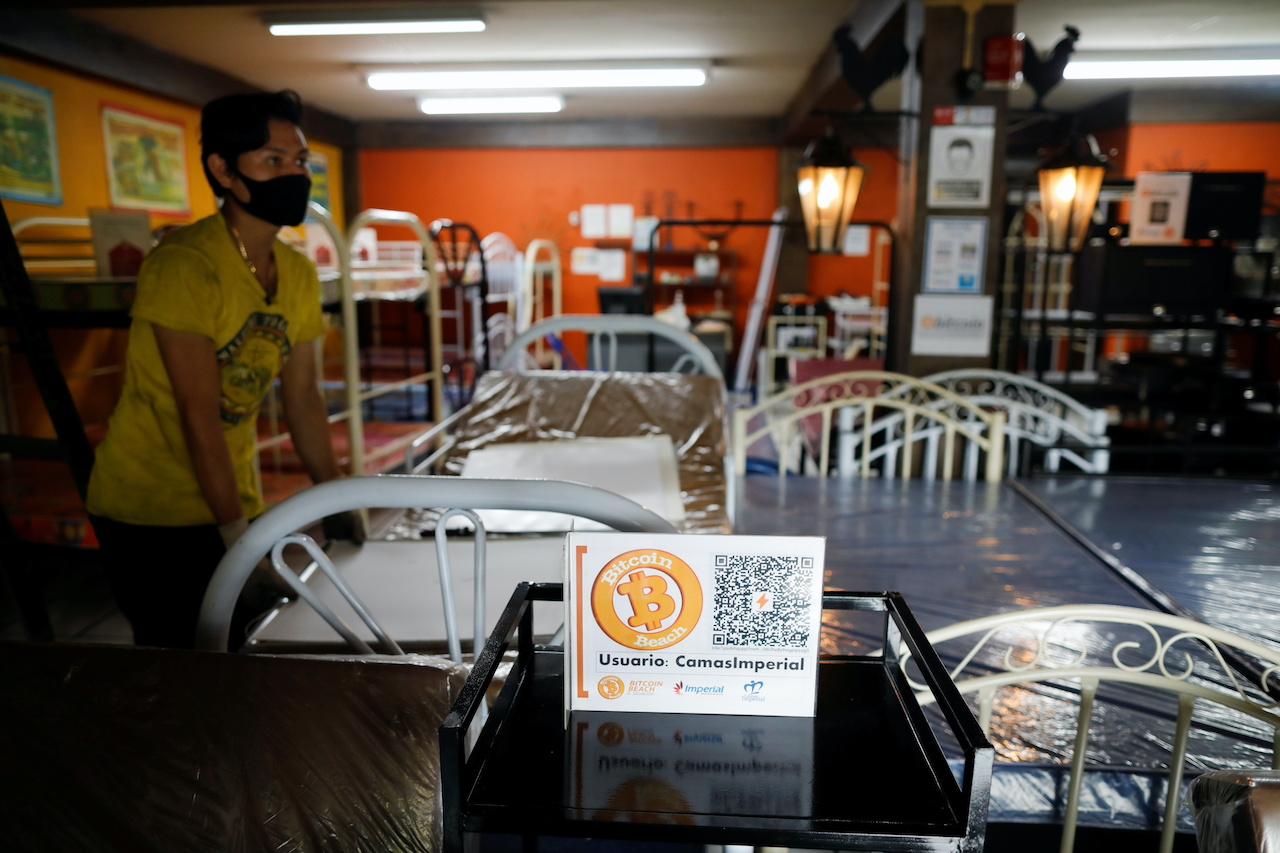 A worker waits at a furniture store in Santa Tecla, El Salvador, where bitcoin is now accepted as a payment method. Photo: Reuters