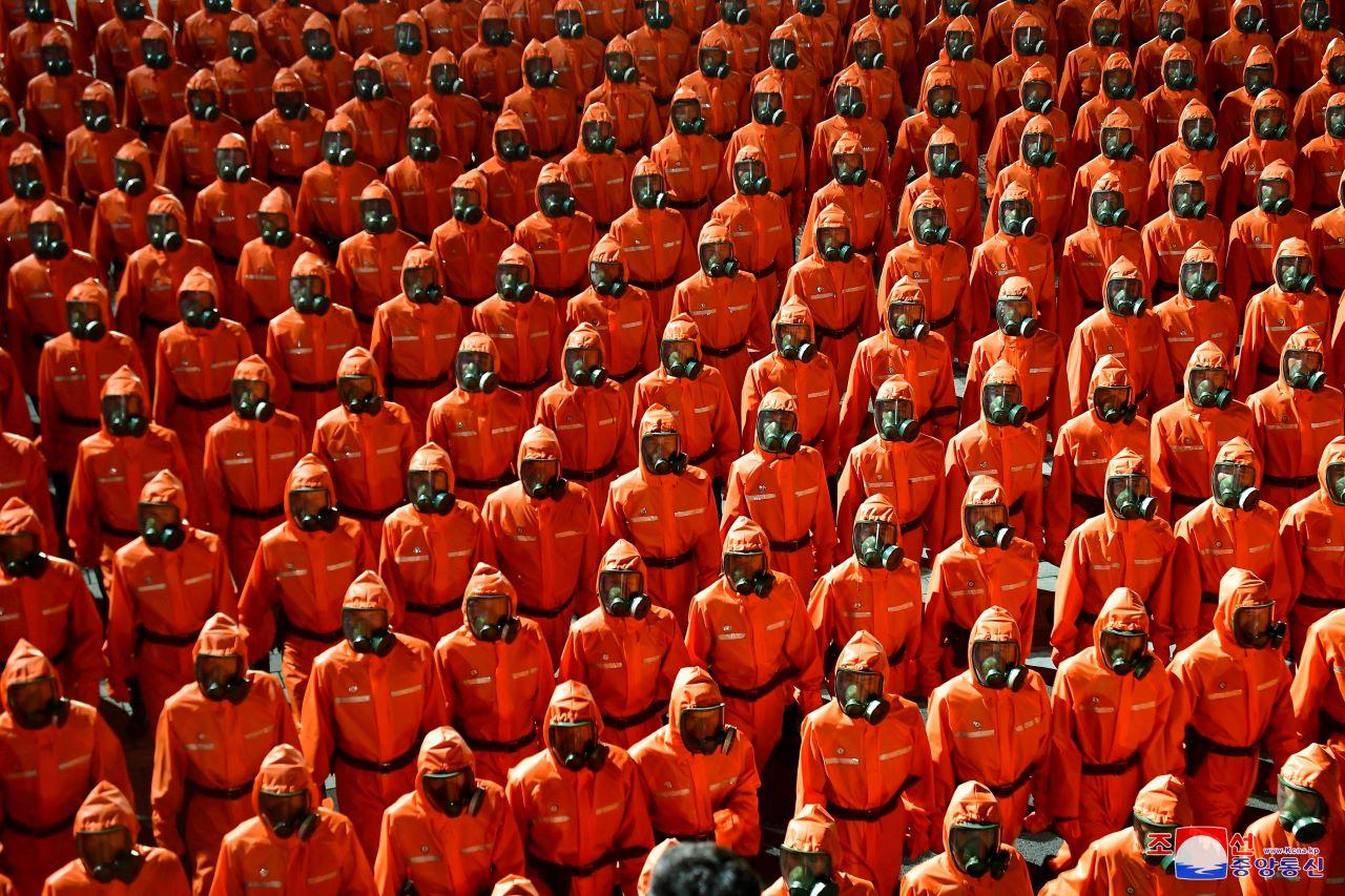 Personnel in orange hazmat suits march during a paramilitary parade held to mark the 73rd founding anniversary of the republic at Kim Il Sung square in Pyongyang in this undated image supplied by North Korea's Korean Central News Agency on Sept 9. Photo: Reuters