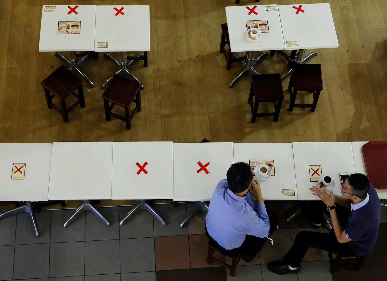 Diners observe social distancing at a cafe during the Covid-19 outbreak in Singapore, Sept 7. Photo: Reuters