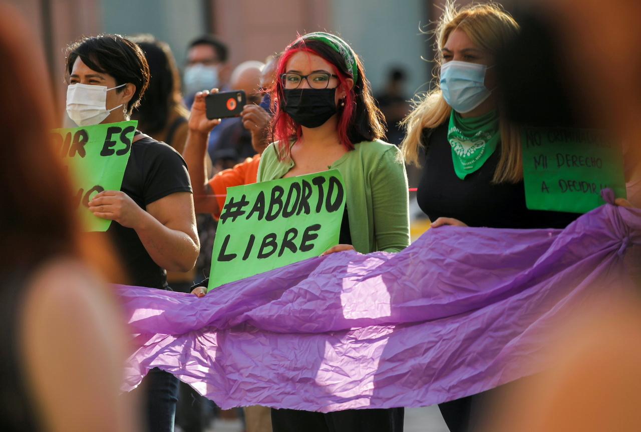 FILE PHOTO: A woman holds a banner which reads "Free abort" during a protest to celebrate the decision of the Supreme Court of Justice of the Nation (SCJN) that declared the criminalization of abortion as unconstitutional, in Saltillo