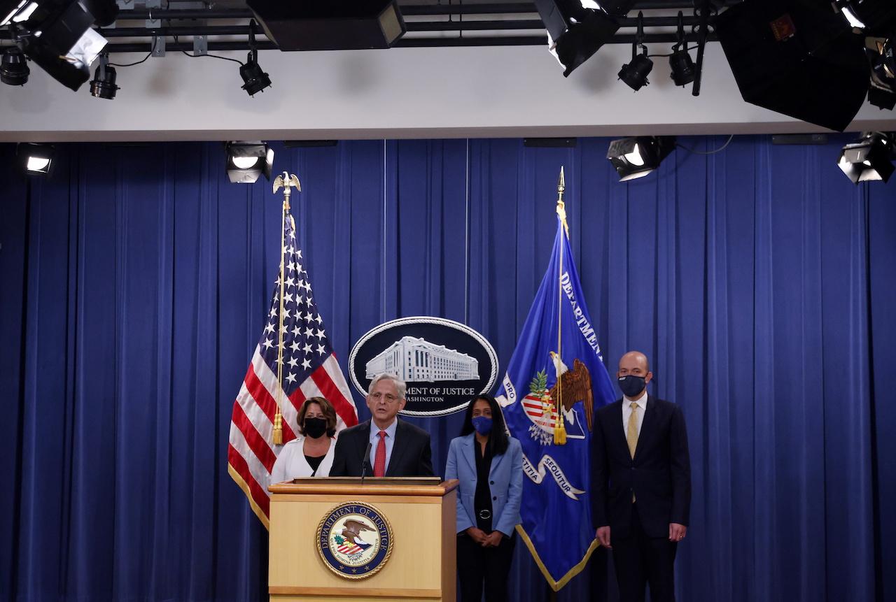 US Attorney-General Merrick Garland, accompanied by Deputy Attorney-General Lisa Monaco and Associate Attorney-General Vanita Gupta, and another associate announces a civil lawsuit against Texas over its abortion law, during a news conference at the Justice Department in Washington, DC, Sept 9. Photo: Reuters