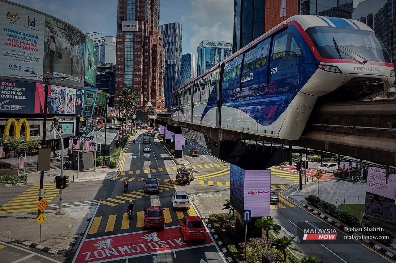 Traffic begins to build up at the intersection of Jalan Sultan Ismail and Jalan Bukit Bintang in Kuala Lumpur. The capital city transitioned to Phase Two of the National Recovery Plan today alongside Selangor and Putrajaya.