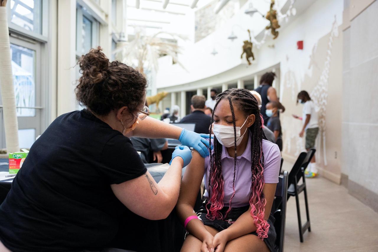 A teenager gets her second dose of Covid-19 vaccine at the Philadelphia Zoo in Philadelphia, Pennsylvania, Sept 7. Photo: Reuters