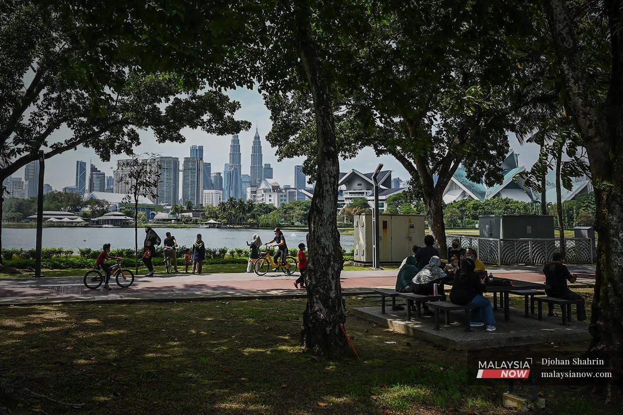 Families enjoy a day out at Taman Tasik Titiwangsa in Kuala Lumpur as restrictions are gradually eased.