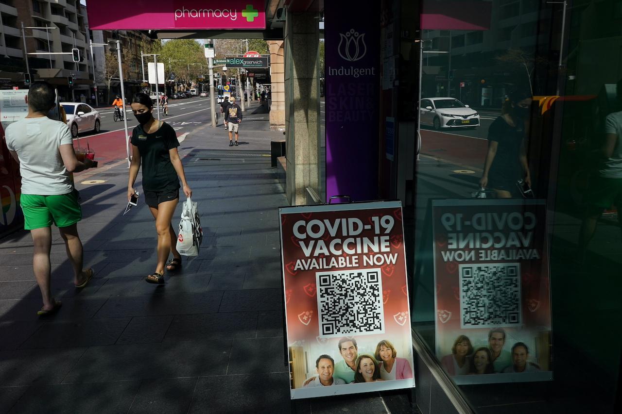 A sign advertises the availability of Covid-19 vaccine doses at a city centre pharmacy during a lockdown to curb the spread of an outbreak in Sydney, Australia, Sept 9. Photo: Reuters