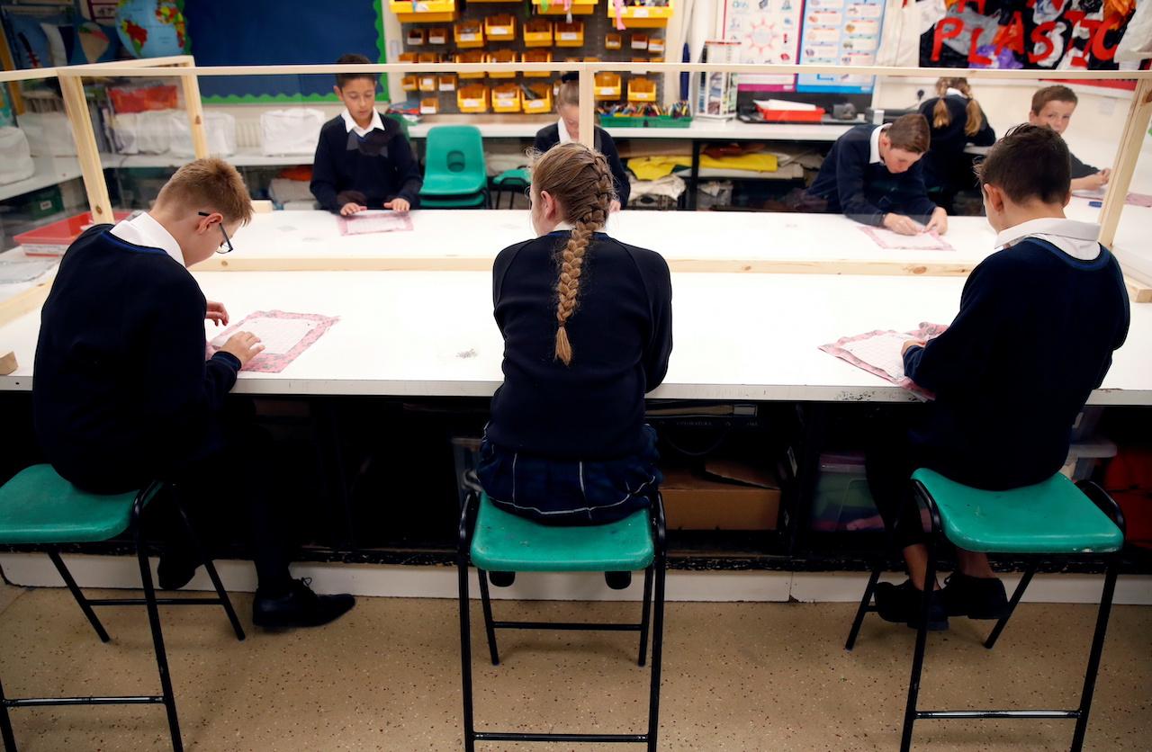 Children sit in a classroom on their first day of school amid the Covid-19 outbreak, in Watton at Stone, Britain, in this Sept 3, 2020 file photo. Photo: Reuters