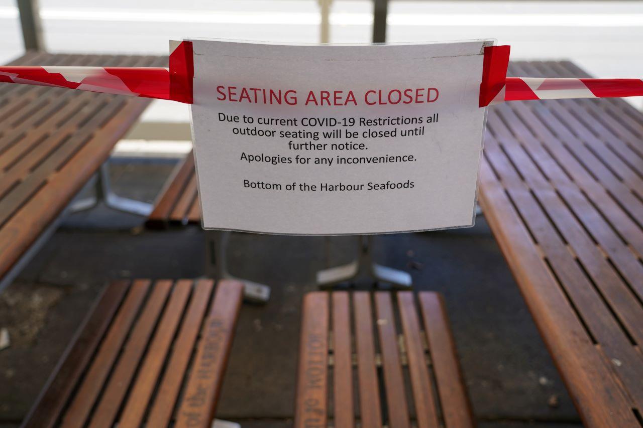 A sign marks the closure of a cafe seating area at Balmoral Beach during a lockdown to curb the spread of the Covid-19 outbreak in Sydney, Australia, Sept 8. Photo: Reuters