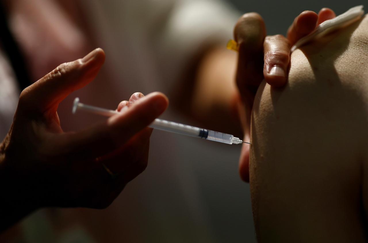 A medical worker administers a dose of Covid-19 vaccine in a vaccination centre in Nantes, France, Sept 14. Photo: Reuters