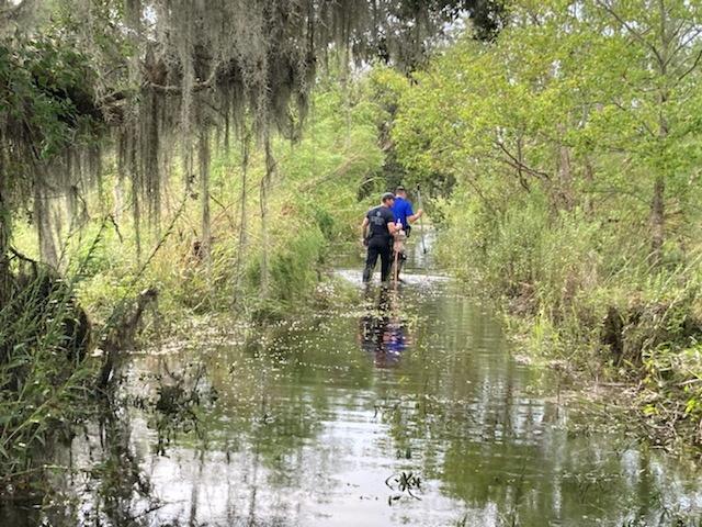 Officers of the St Tammany Parish Sheriff's Office search for an alligator believed to have killed a man after Hurricane Ida in Slidell, Louisiana, in this handout picture obtained by Reuters on Sept 14. Photo: Reuters