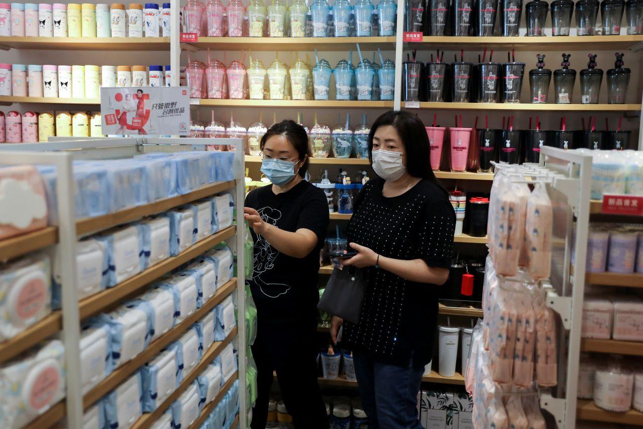 Customers shop at a store of a Chinese retailer in Beijing, Sept 13. Photo: Reuters