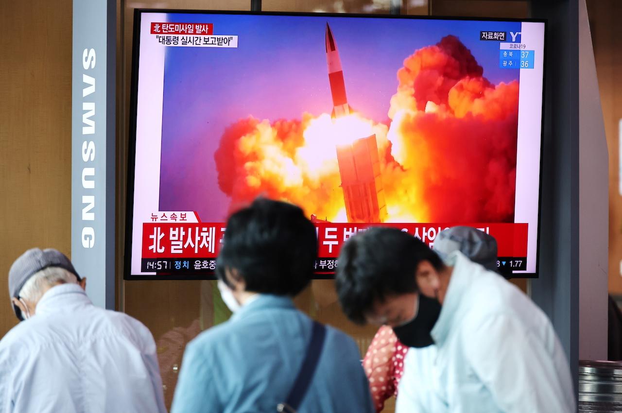 People watch a TV broadcasting file footage of a news report on North Korea firing what appeared to be a pair of ballistic missiles off its east coast, in Seoul, South Korea, Sept 15. Photo: Reuters