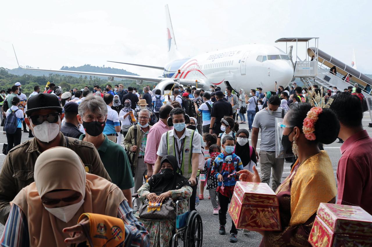 Tourists arrive at the airport as Langkawi reopens to domestic visitors on Sept 16. Photo: Reuters