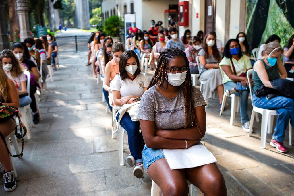 Teenage girls wait their turn to be injected with a dose of the Pfizer Covid-19 vaccine, on the first day of a vaccination campaign for 17-year-olds, at a vaccination center in Rio de Janeiro, Brazil, Aug 26. Photo: AP