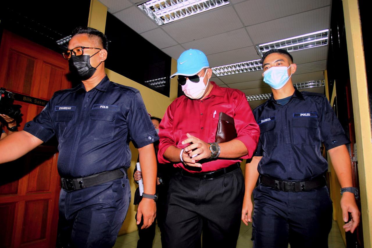 Mohd Faizal Amir (centre) at the Sessions Court in Teluk Intan today. Photo: Bernama