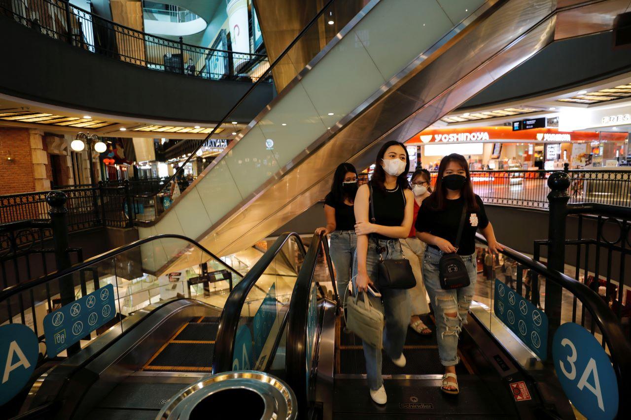 Visitors wearing protective masks walk at a shopping mall after the ease of restrictions amid the Covid-19 pandemic in Jakarta, Indonesia, Sept 16. Photo: Reuters
