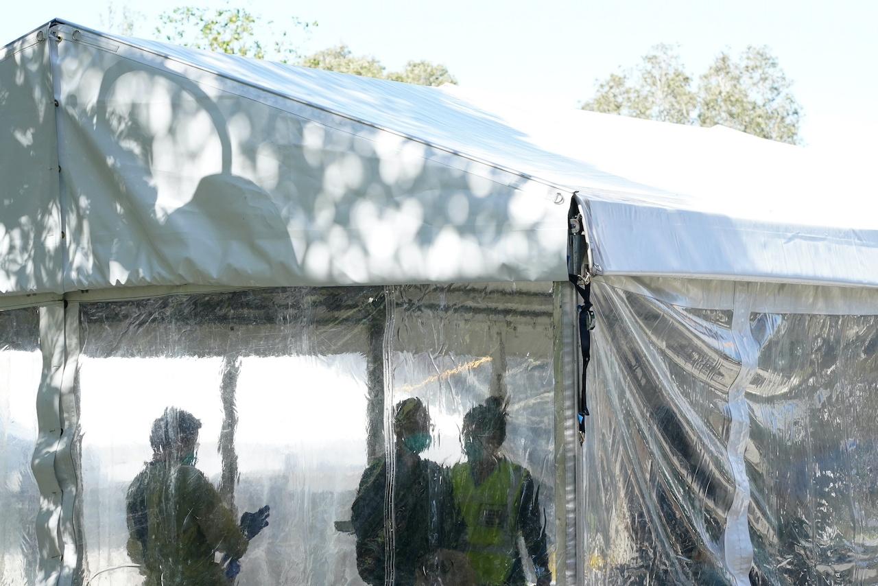 Health personnel work inside a vaccination clinic set up for residents of surrounding public housing towers in Sydney, Australia, Sept 17. Photo: Reuters